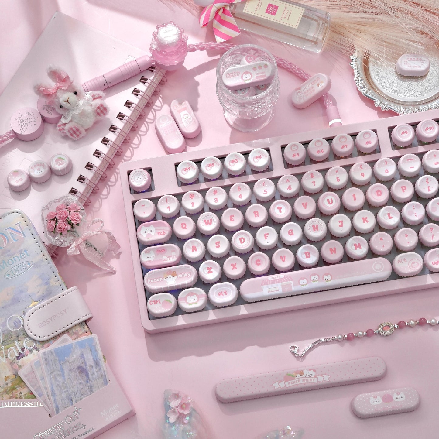 Detail shot of pastel pink kawaii White Peach Milk PBT keycaps with cute prints