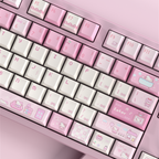 A close-up of a pastel pink mechanical keyboard with cute Hello Kitty themed keycaps, set against a matching pink background.