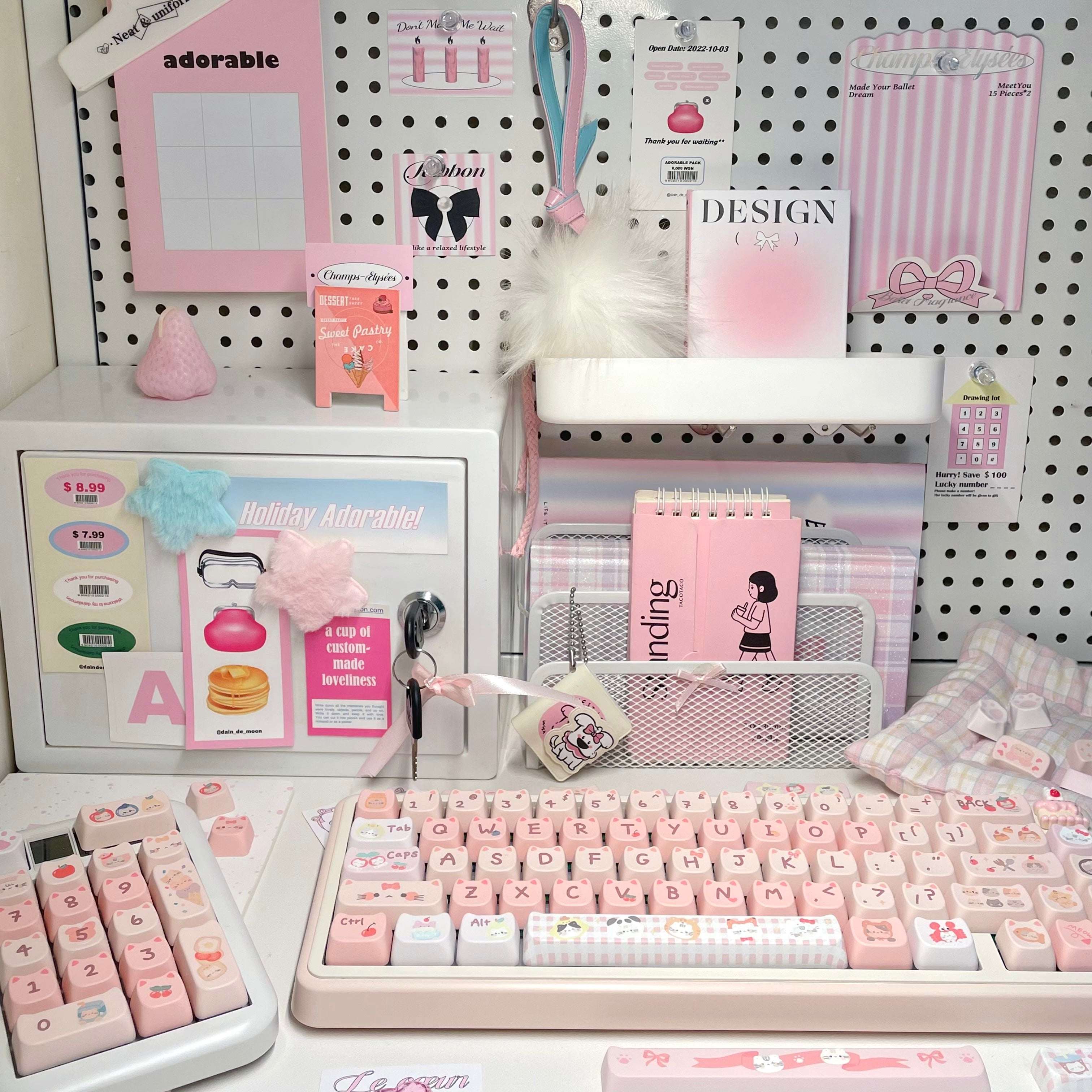 Close-up of cat-themed novelty keycaps in pink and white tones