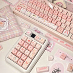140-key PBT keycaps with kawaii cat paw and ribbon designs