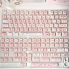 Side view of sculpted MAO profile cat keycaps on a white keyboard