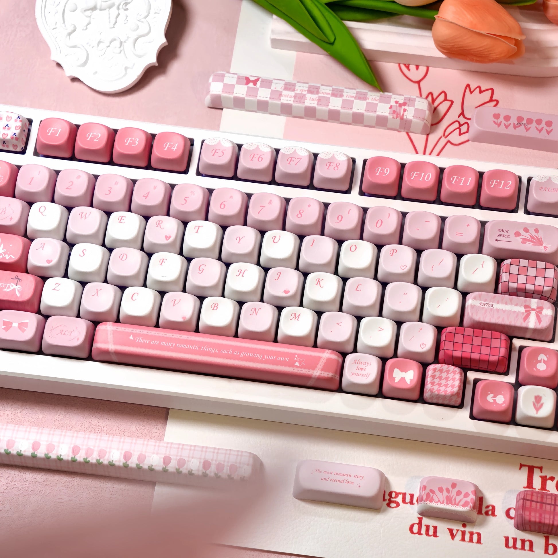 Close-up of MOA Profile Tulip pastel pink PBT keycaps with dye-sublimated floral and heart patterns