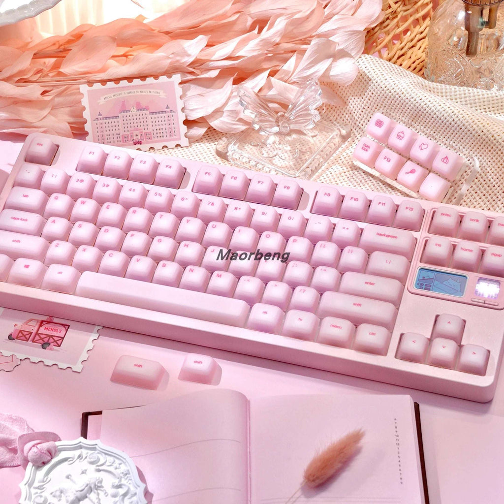 Mechanical keyboard with soft silicone keycaps installed, glowing with RGB lights