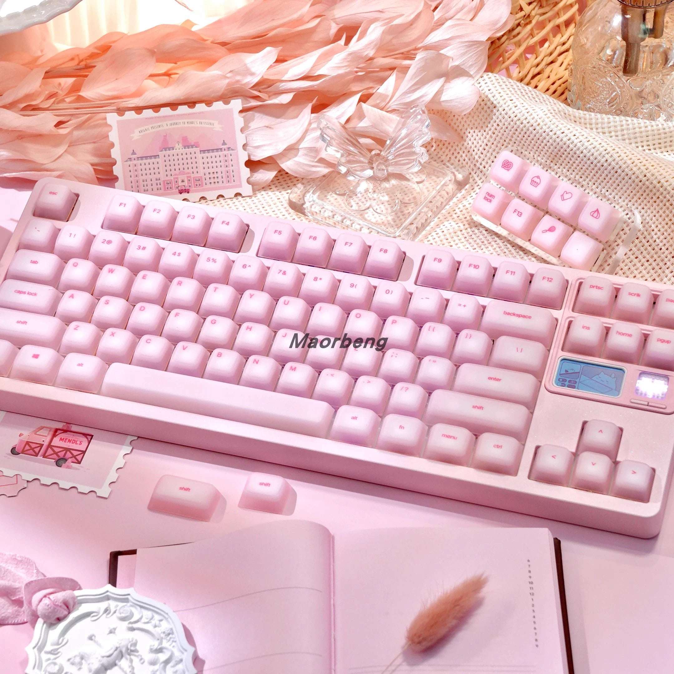Mechanical keyboard with soft silicone keycaps installed, glowing with RGB lights