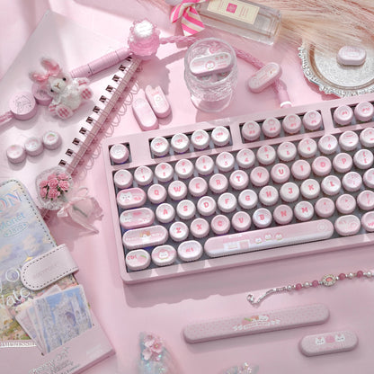 Detail shot of pastel pink kawaii White Peach Milk PBT keycaps with cute prints