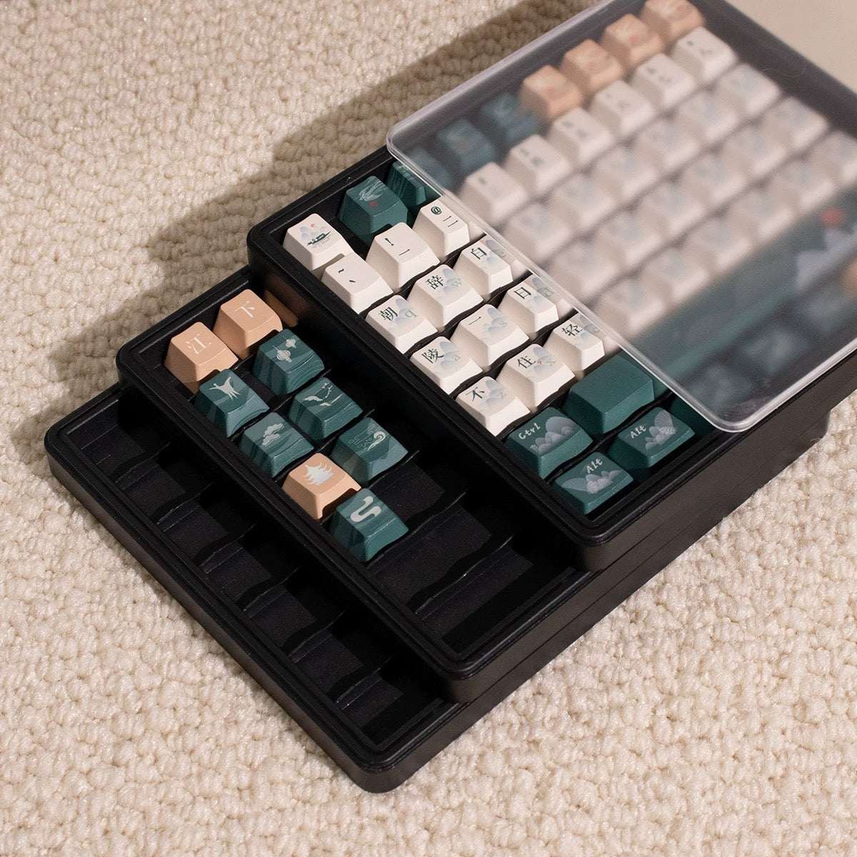 Plastic keycap box with removable layers and clear top