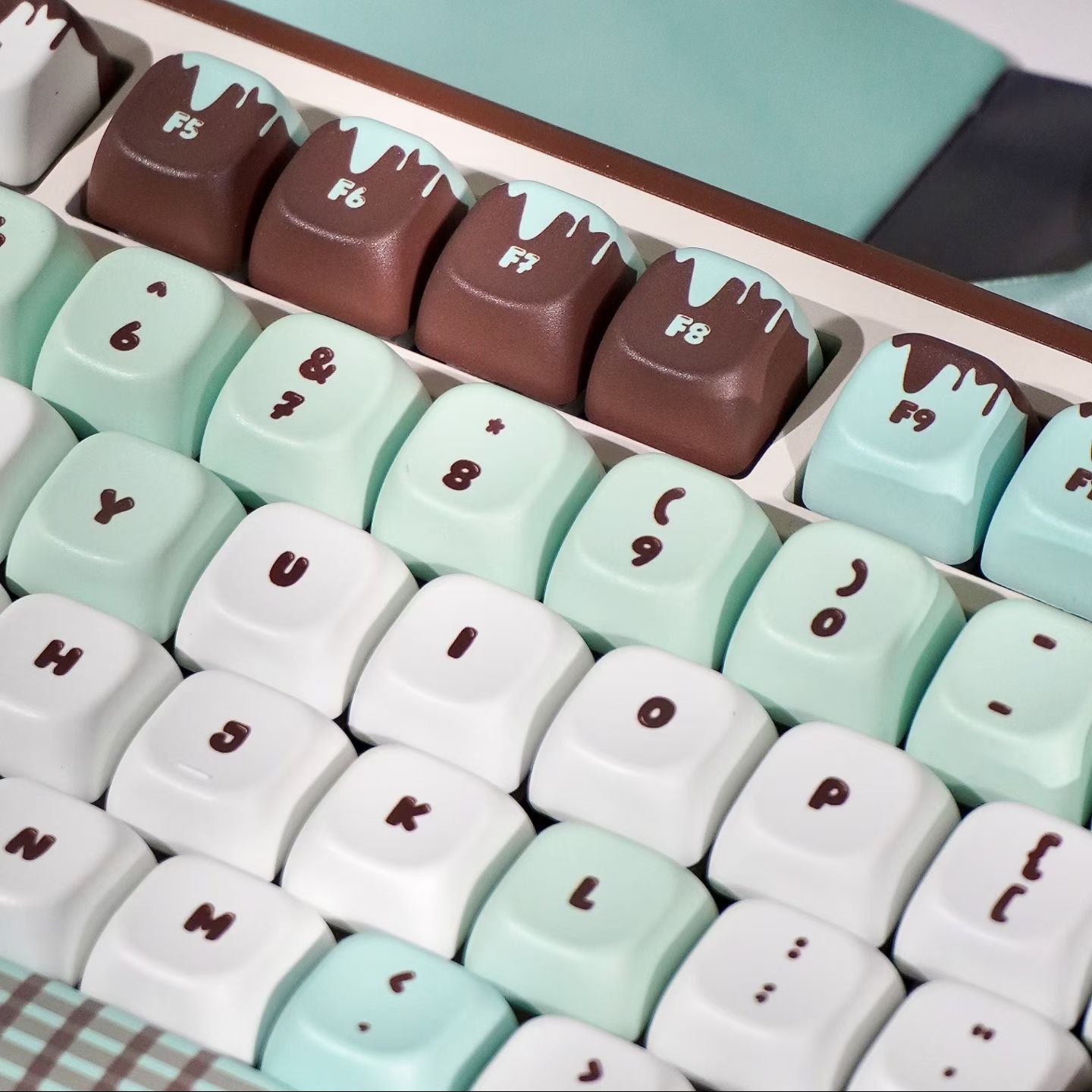 Close-up of a set of colorful keyboard keys with unique character designs.