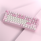 A pastel pink and white mechanical keyboard with decorative keycaps, photographed at an angle on a matching pink studio background.