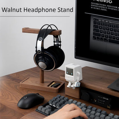 Desk setup with black walnut headphone stand and accessories