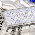 Transparent keyboard with white keys on a newspaper background