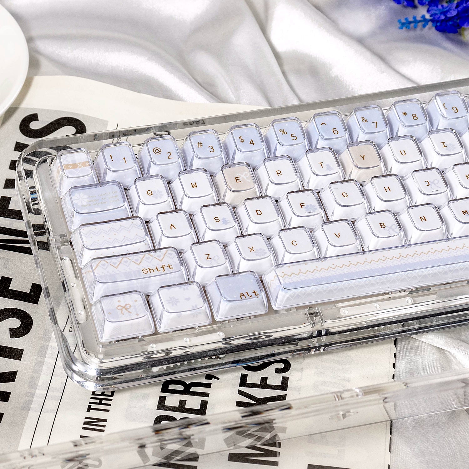 Transparent keyboard with white keys on a newspaper background
