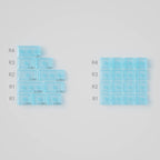 Set of blue silicone ice cube trays on a gray background
