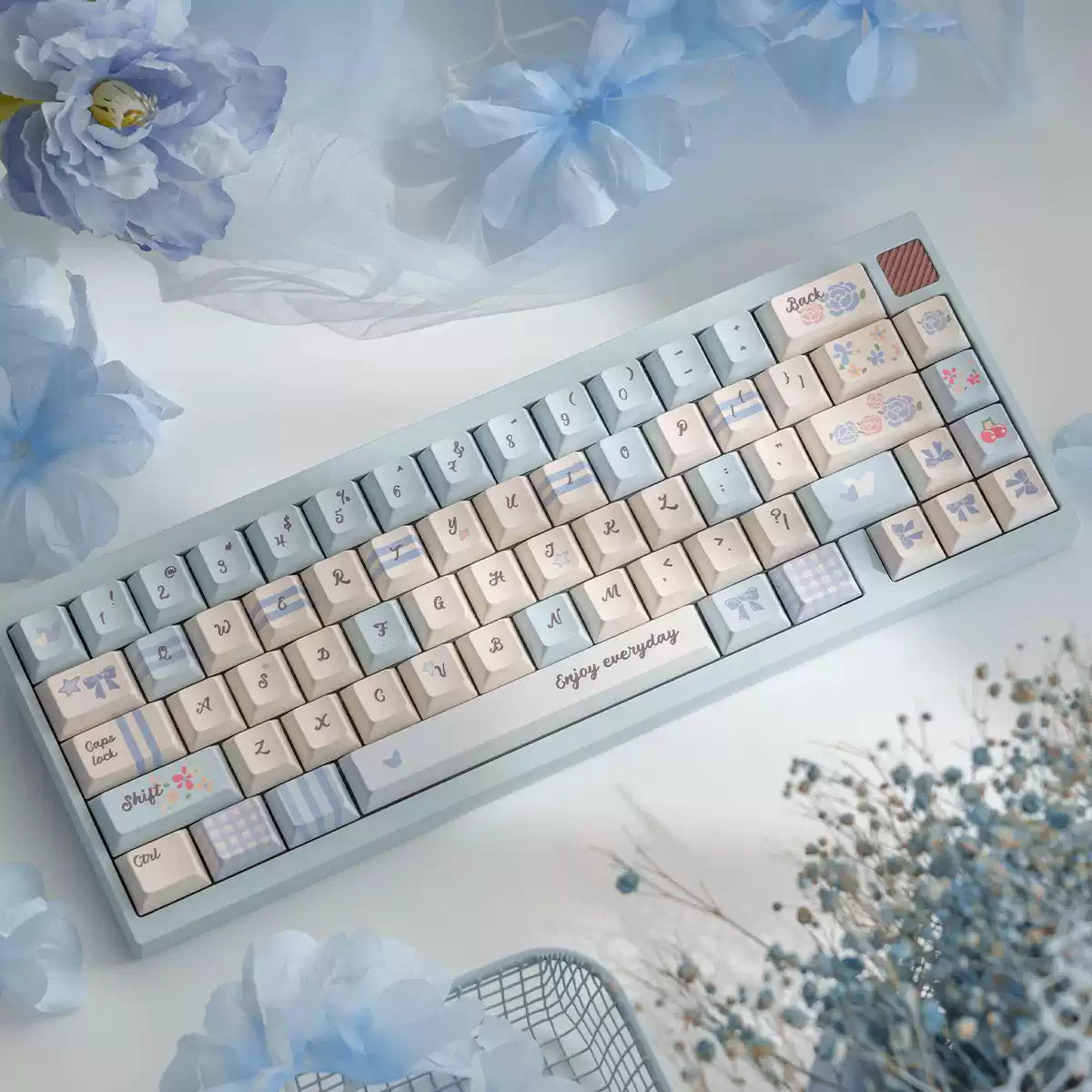 Keyboard with decorative keys on a light background with flowers