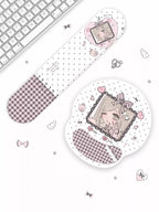 A cute desk accessory set featuring a long, narrow mouse pad and a round mouse pad with a pastel anime girl illustration, both decorated with pink gingham checkers and white polka dots, displayed on a white surface next to a keyboard.