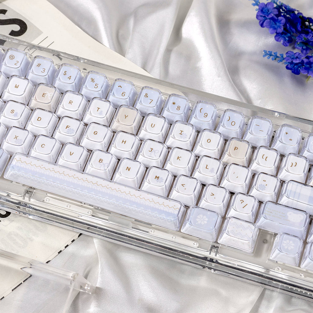 Mechanical keyboard with clear keycaps on a white fabric background
