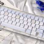 Mechanical keyboard with clear keycaps on a white fabric background