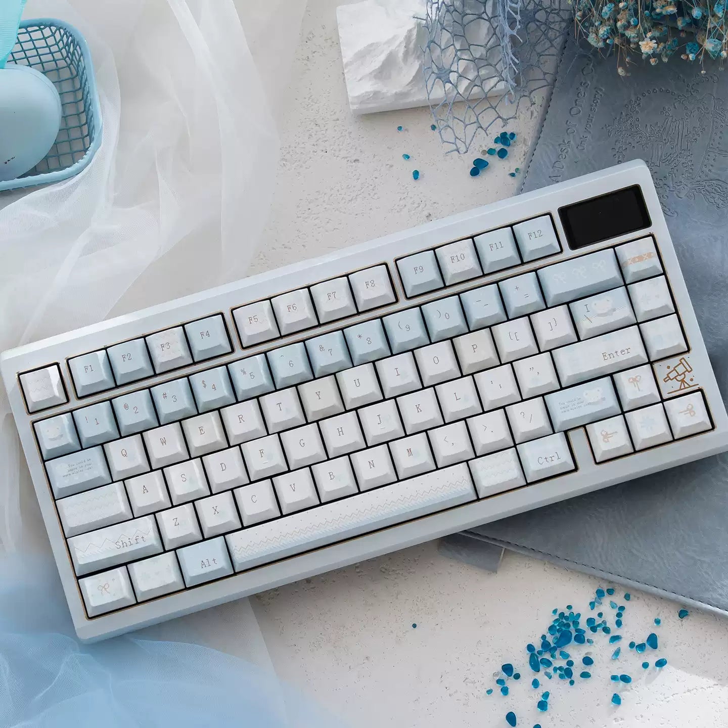 Mechanical keyboard with gradient keys on a light surface with decorative elements