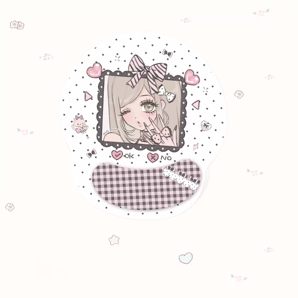 A round white sticker or decal featuring a cute anime-style girl illustration with a pink bow, hearts, stars, and a pink-and-white gingham band at the bottom, shown on a very light cream background with faint decorative doodles.