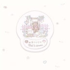A round gel pad with a cute pastel illustration of a teddy bear on a swing, small animals, flowers, and the text 'Girl's dream' on a white background with scattered pastel decorative icons.