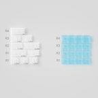 Set of clear and blue silicone molds on a gray background