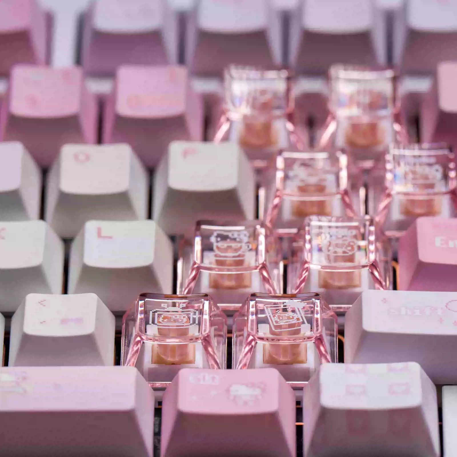 Close-up of a mechanical keyboard with pastel pink and white keycaps, featuring clear switches with pink internal components and thin pink wiring.