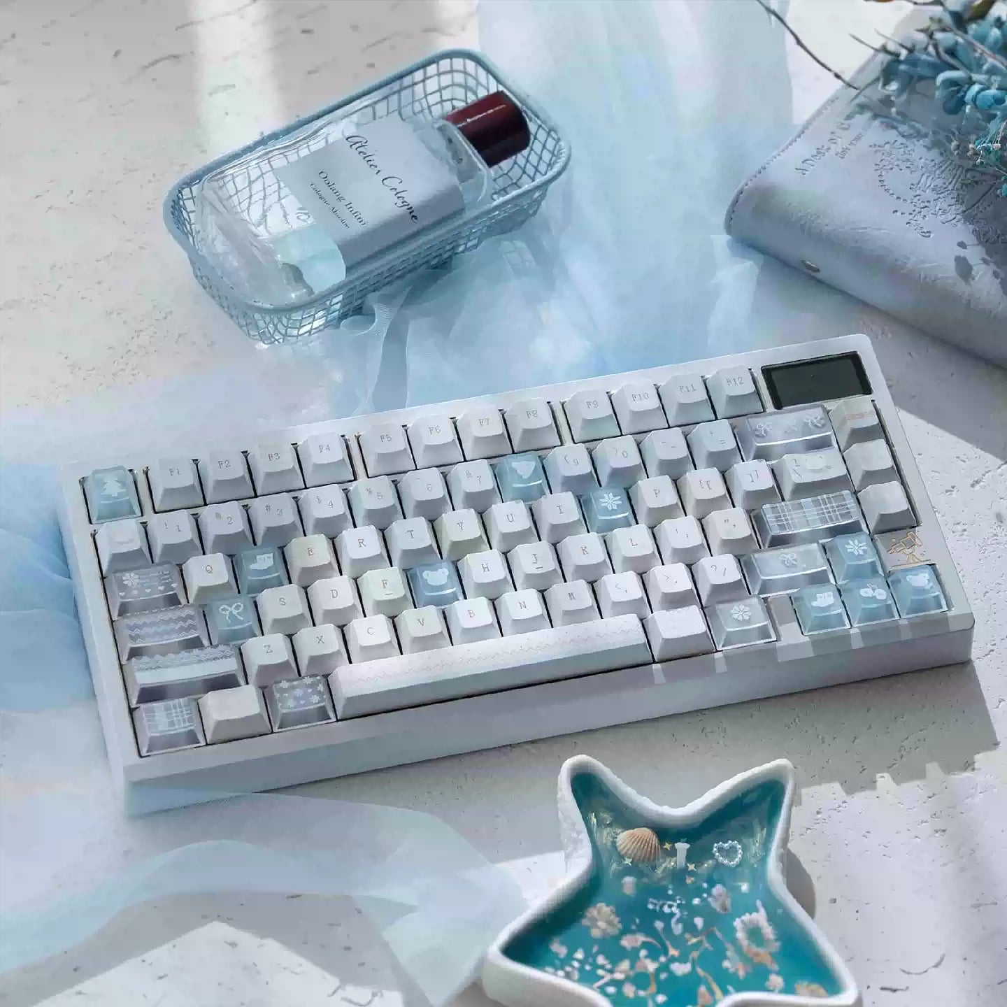 Mechanical keyboard with gradient keycaps on a light surface with decorative items.