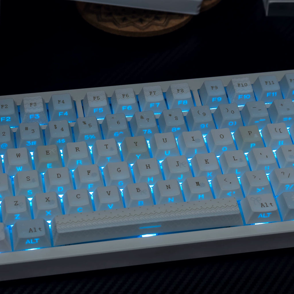 White keyboard with blue backlighting on a dark surface