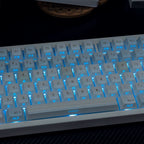 White keyboard with blue backlighting on a dark surface