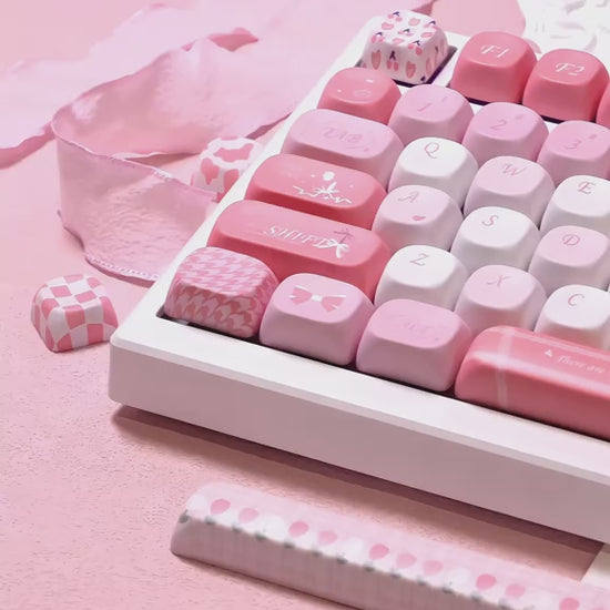 Side view of MOA Profile Tulip 140-key pastel pink and white keycap set on a white mechanical keyboard